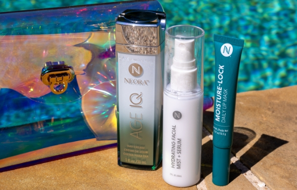 Poolside screen featuring the Summer Skin Essentials Set, which includes x Age IQ Day Cream, Hydrating Facial Mist, a Moisture Lock Lip Mask, and a free Holographic Travel Bag 